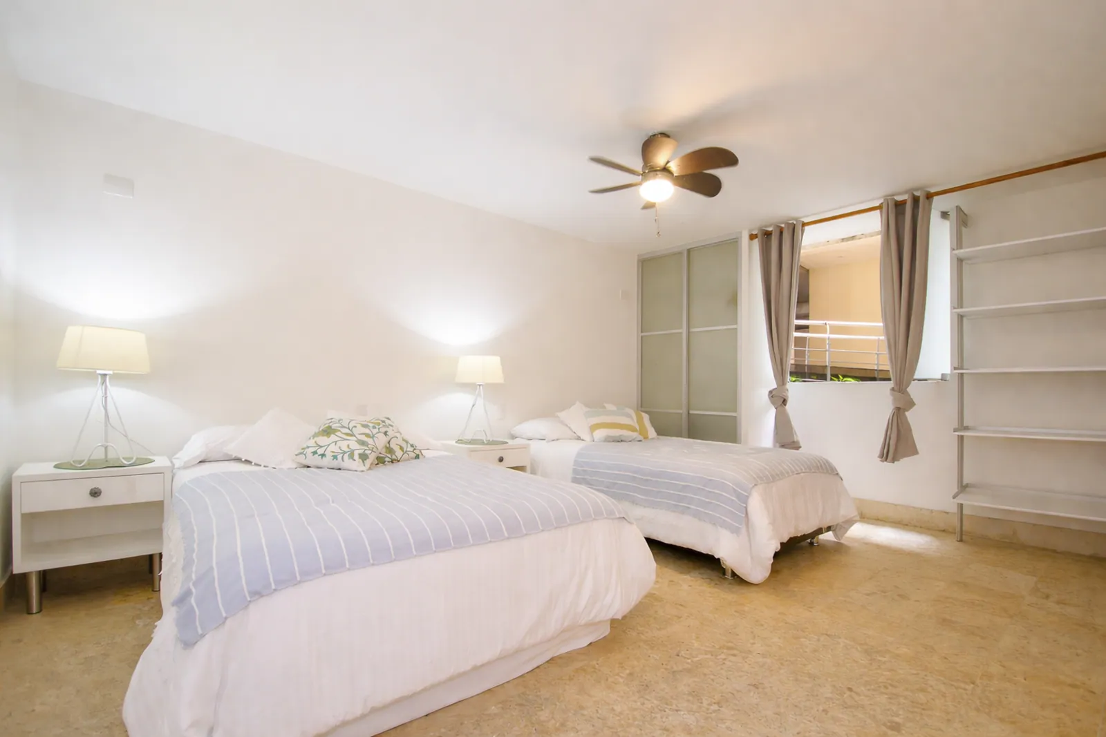 Bedroom with two single beds and wardrobe
