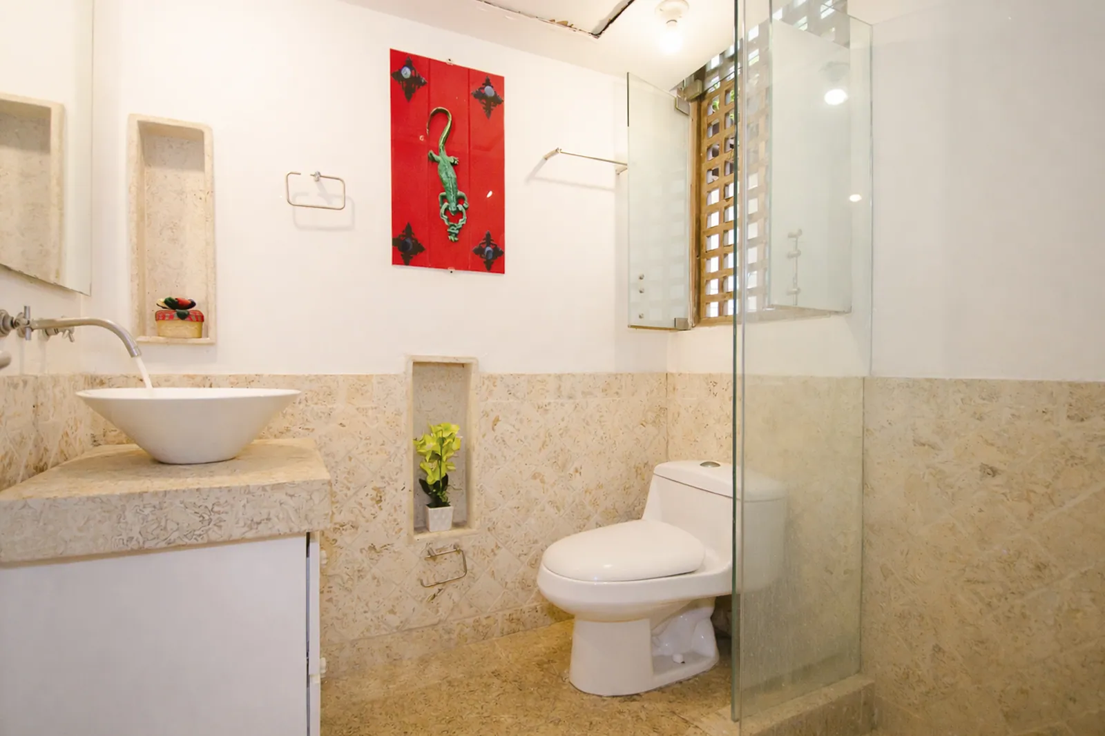 Coral-stone bathroom with walk-in shower