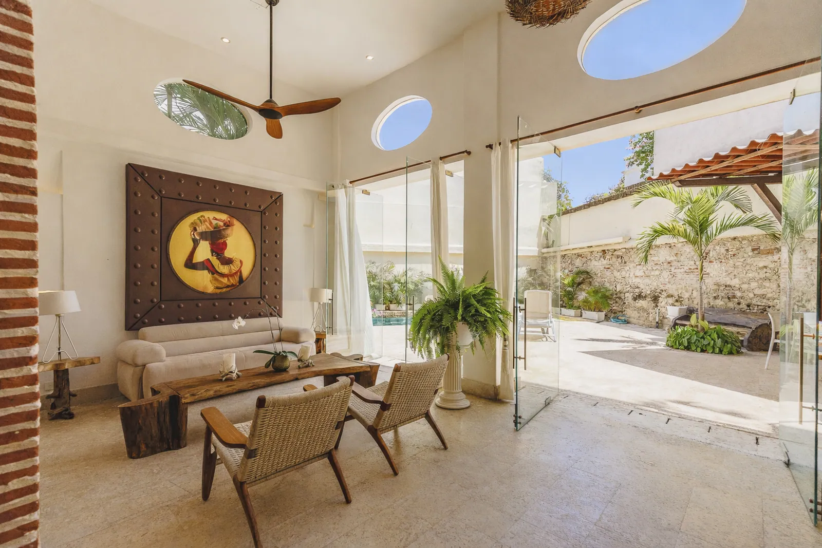 Double-height living room opening onto the terrace and private pool, Cartagena